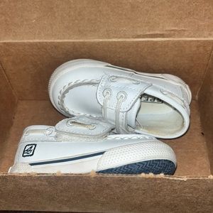 Infant white Sperry baby shoes. Velcro strap.